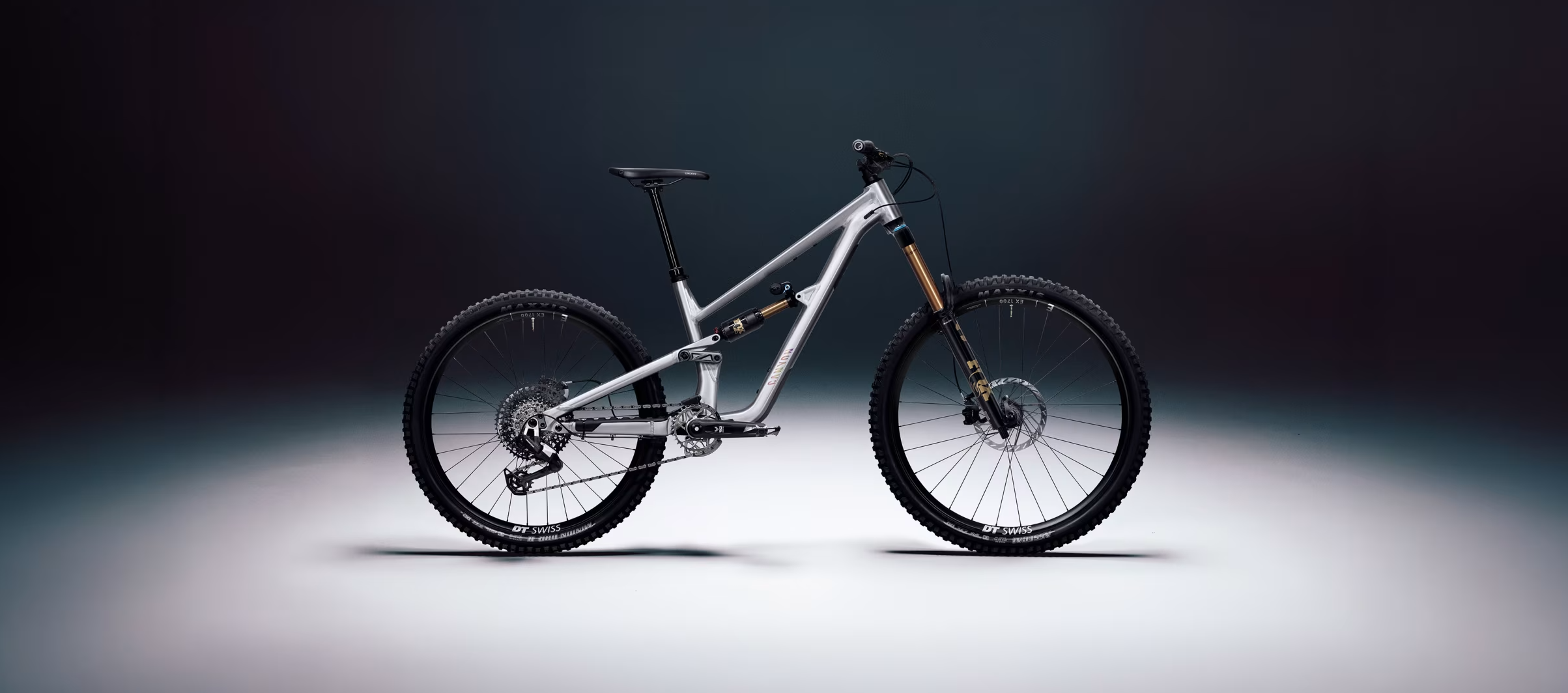 Side view of a Canyon mountain bike against a studio backdrop.